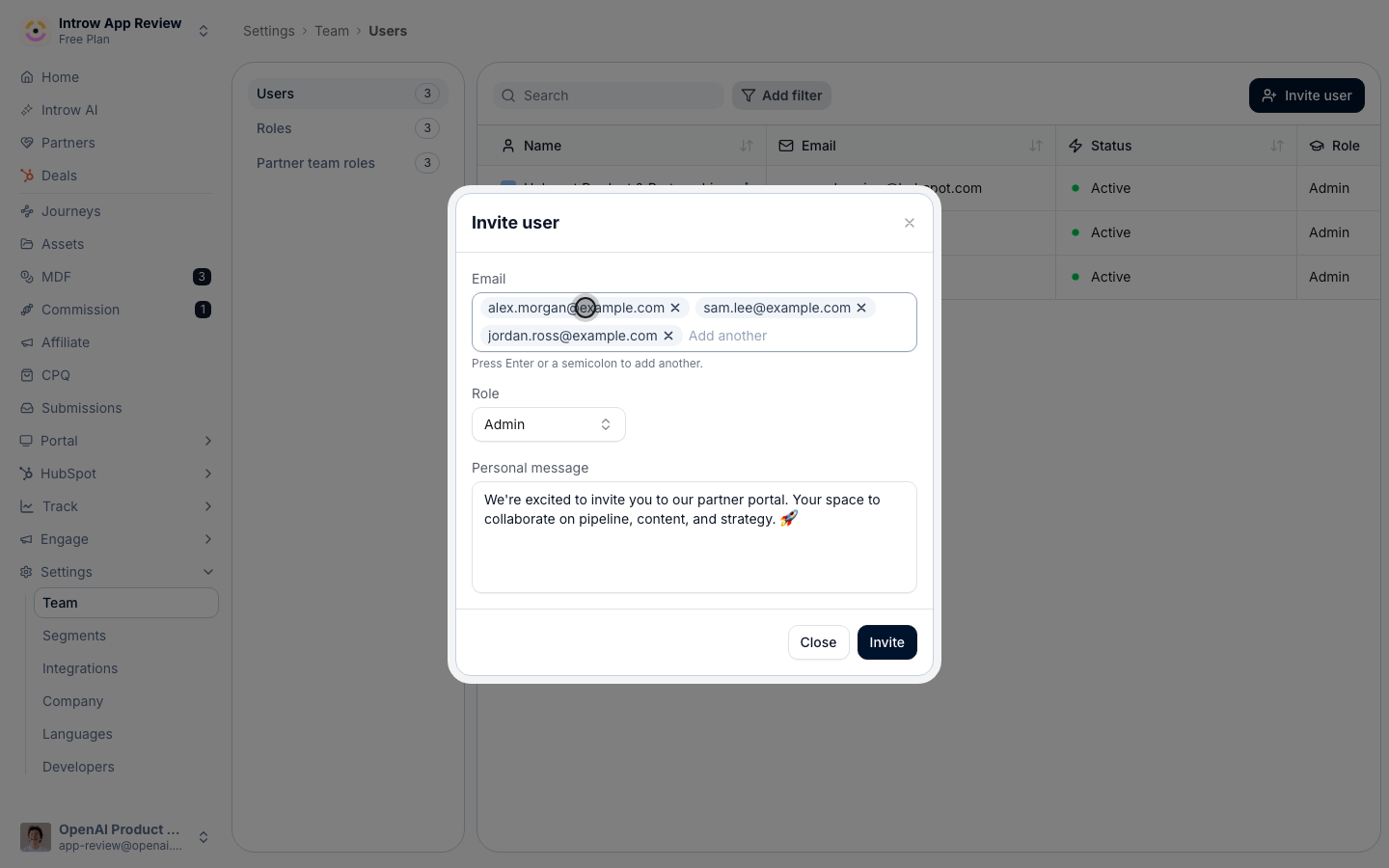 The Invite user dialog with three email addresses entered as removable pills above the Role picker and the personal message.